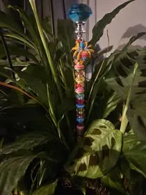 Beaded garden stake in plant