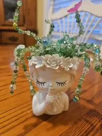 Beaded plant in a peaceful face planter