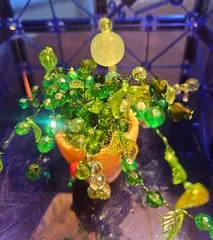 Bright green beaded plant with lights