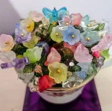 Pastel beaded flowers in a teacup