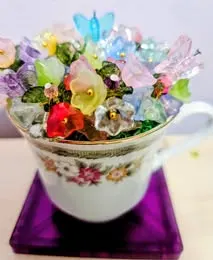 Pastel beaded bouquet in teacup